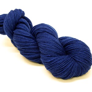 May include: A skein of deep blue yarn, perfect for knitting or crocheting.