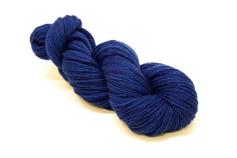 May include: A skein of deep blue yarn, perfect for knitting or crocheting.