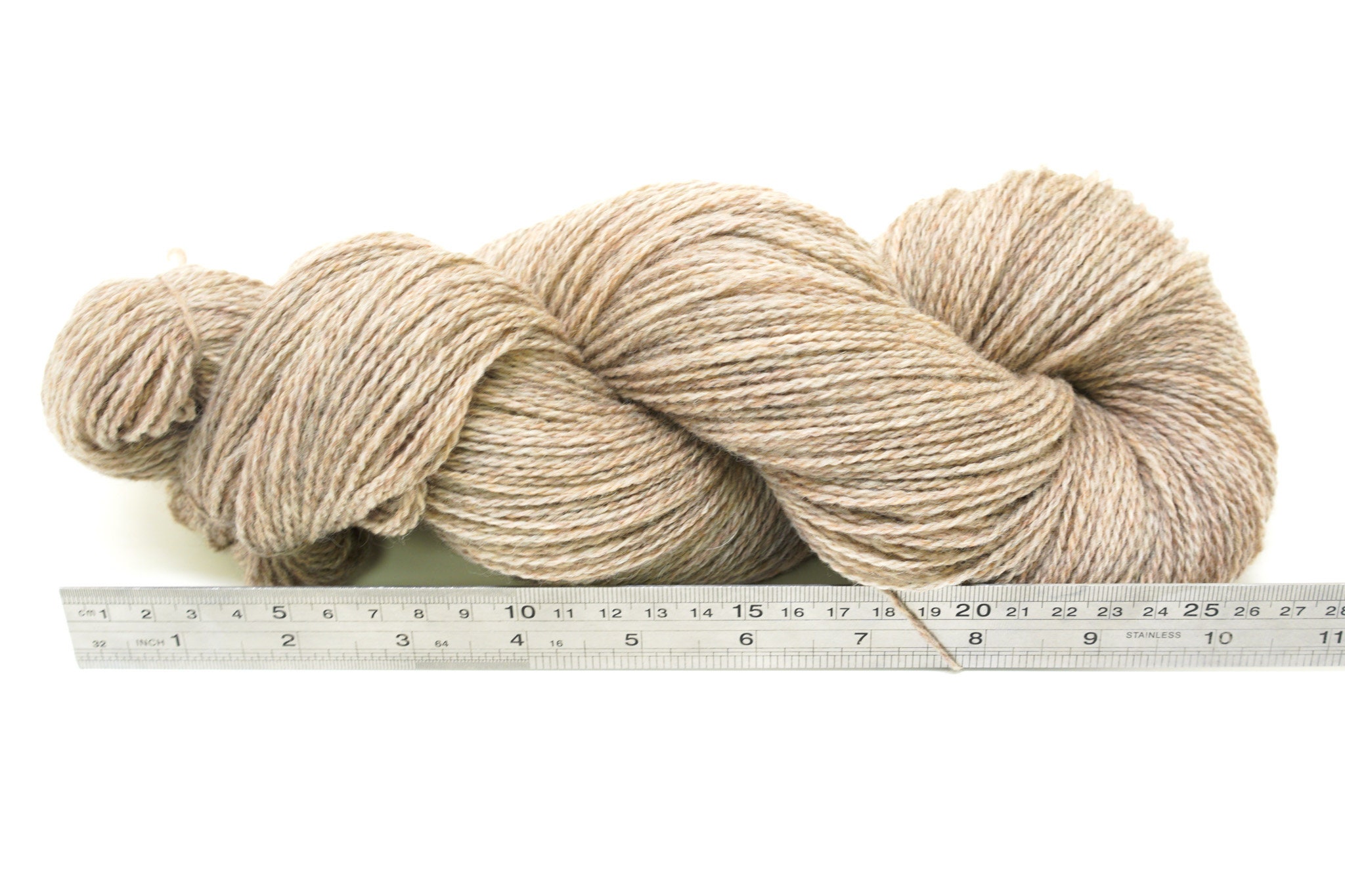 Neutral beige yarn for knitting is in the basket. Woolen warm so Stock  Photo by ©dalivl@yandex.ru 253954778