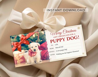 May include: A gift certificate for a puppy dog, with the text "Merry Christmas." The certificate is on top of a wrapped gift with a cream-colored bow. The certificate includes a photo of a puppy with a red bow.