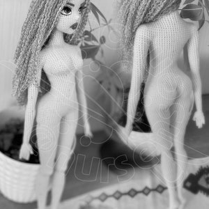 May include: A crocheted doll with long, curly hair. The doll is nude and has a detailed face with painted eyes and lips.