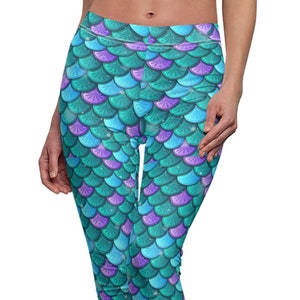 May include: Teal and purple leggings with a mermaid scale pattern.