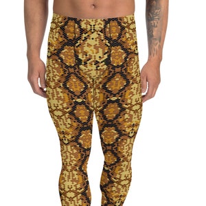 May include: A pair of black and gold leggings with a snake skin pattern.