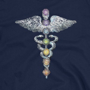 May include: Navy blue t-shirt featuring a white caduceus symbol with a snake and seven colourful chakra stones. The caduceus is surrounded by wings.