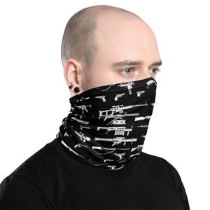 May include: A black neck gaiter with a white pattern of various firearms. The pattern includes pistols, rifles, and shotguns.