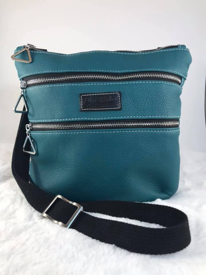 Teal Leather cross body handbag. Etsy