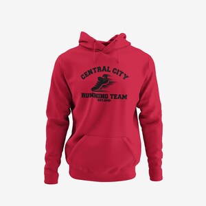 May include: A red hoodie with a front pocket and drawstring hood. The black graphic on the front reads "CENTRAL CITY RUNNING TEAM" with a running shoe design and "EST.1940" below. A casual athletic apparel item.