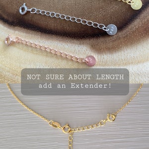 May include: Three gold chain necklace extenders with a small round tag that says "P&P" on each. The text "NOT SURE ABOUT LENGTH add an Extender!" is visible in the image.
