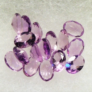 nice 5 x 7 mm oval medium purple faceted Amethyst Brazil .65 cts average each
