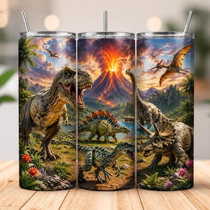 May include: A cylindrical metal tumbler with a straw featuring a prehistoric scene with an erupting volcano, a Tyrannosaurus Rex, a Triceratops, a Stegosaurus, and a flying Pterodactyl amidst lush green vegetation and a vibrant sunset sky.