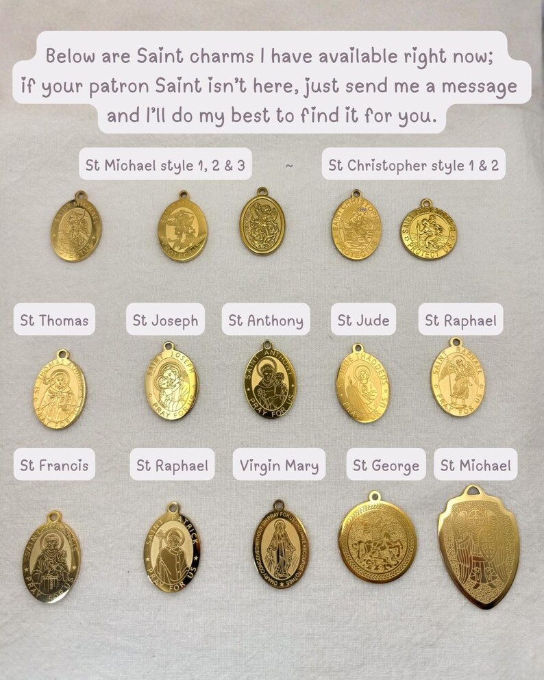 May include: A collection of gold-colored Saint charms in various shapes and designs. The charms feature images of saints such as St. Michael, St. Christopher, and St. Thomas. Text on the image reads, "Below are Saint charms I have available right now."