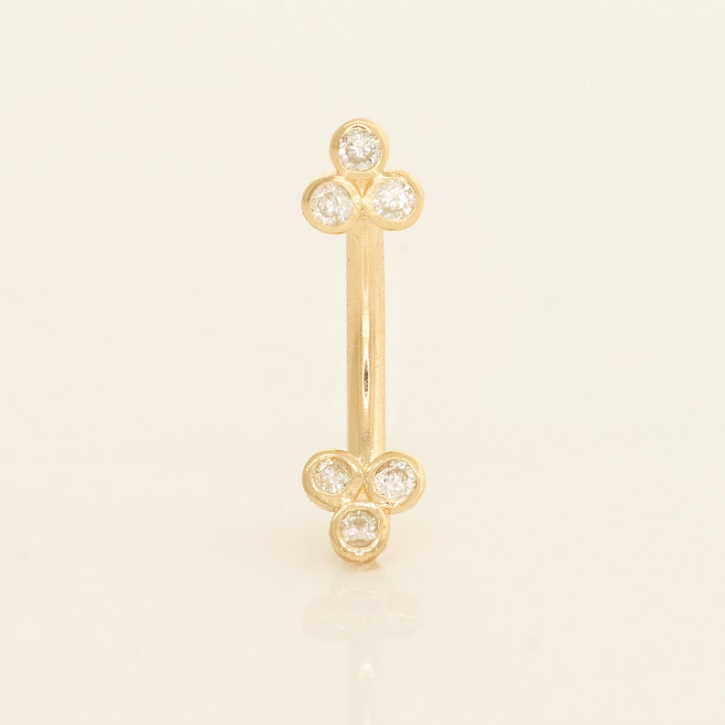 A captivating 14k solid gold trinity piercing adorned with dazzling diamonds, available in both yellow and white gold. Versatile for ear piercings like helix, tragus, or conch, or for adorning other body piercings with elegance and quality.