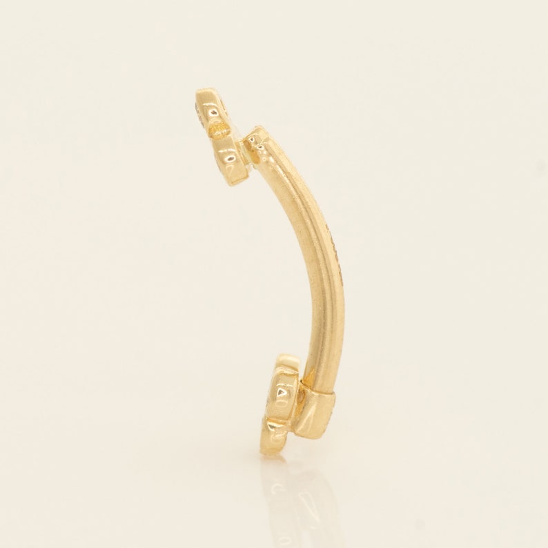 A captivating 14k solid gold trinity piercing adorned with dazzling diamonds, available in both yellow and white gold. Versatile for ear piercings like helix, tragus, or conch, or for adorning other body piercings with elegance and quality.