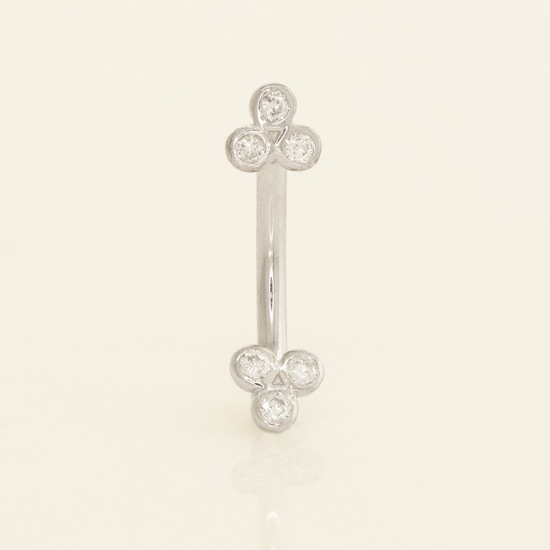 A captivating 14k solid gold trinity piercing adorned with dazzling diamonds, available in both yellow and white gold. Versatile for ear piercings like helix, tragus, or conch, or for adorning other body piercings with elegance and quality.