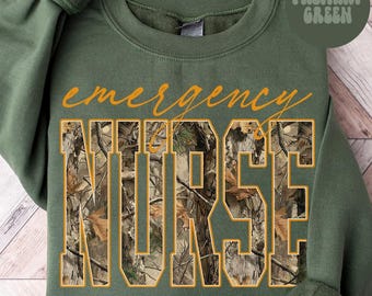 May include: A military green sweatshirt with the words "emergency NURSE" in a gold font. The word "NURSE" is filled with a camouflage pattern. A circular label in the upper right corner reads "MILITARY GREEN".