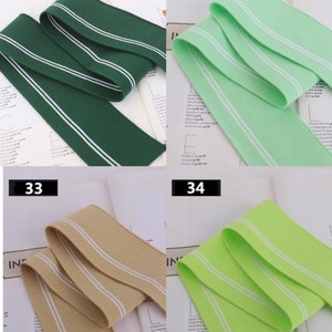 May include: Four different colors of elastic trim with white stripes. The colors are green, light green, beige, and lime green. The trim is 31, 32, 33, and 34.