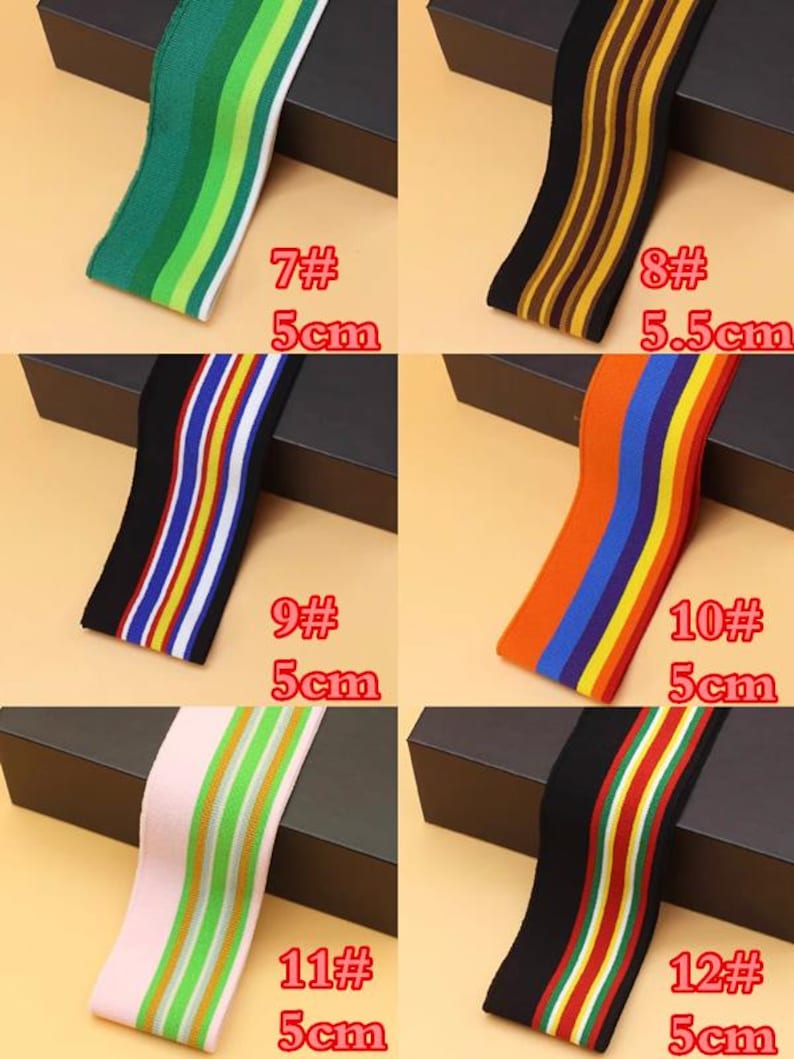 May include: Six different striped elastic bands in various colors, including green, brown, orange, black, pink, and red. The bands are 5 cm wide and are labeled with numbers 7 through 12.