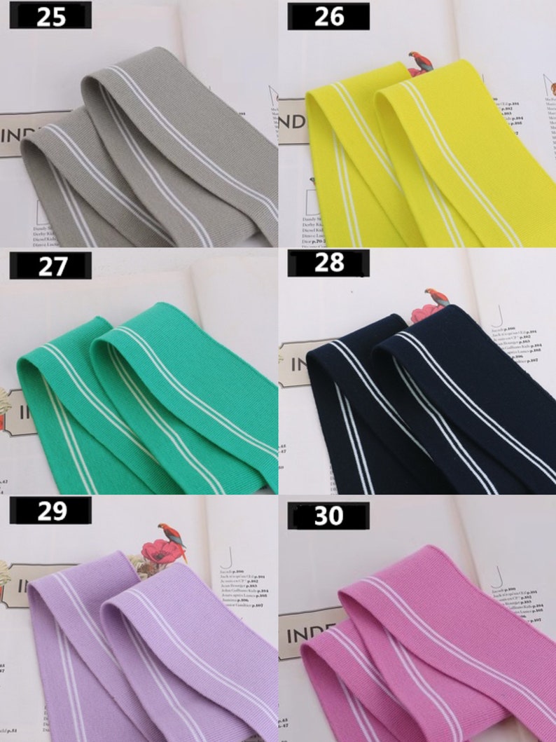 May include: Five different colors of elastic trim with white stripes. The colors are gray, yellow, green, navy blue, and purple. The trim is 25, 26, 27, 28, and 29.