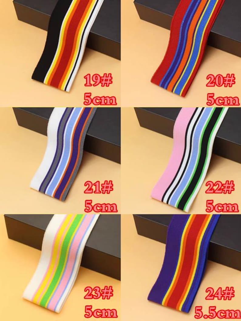 May include: Assortment of 10 striped elastic bands in various colors, including red, blue, green, yellow, white, black, and pink. The bands are 5 cm wide and are labeled with numbers 19 through 24.