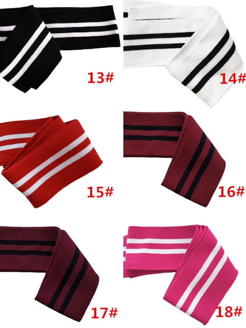 Op de afbeelding: Zes verschillende kleuren gebreide stof met twee witte strepen. De kleuren zijn zwart, wit, rood, bordeauxrood en roze. De stof is gemarkeerd met de nummers 13 tot en met 18.