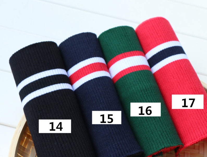 Puede incluir: Cuatro tiras de tejido de punto de canal&eacute; de diferentes colores con rayas blancas. Las tiras est&aacute;n etiquetadas con los n&uacute;meros 14, 15, 16 y 17.