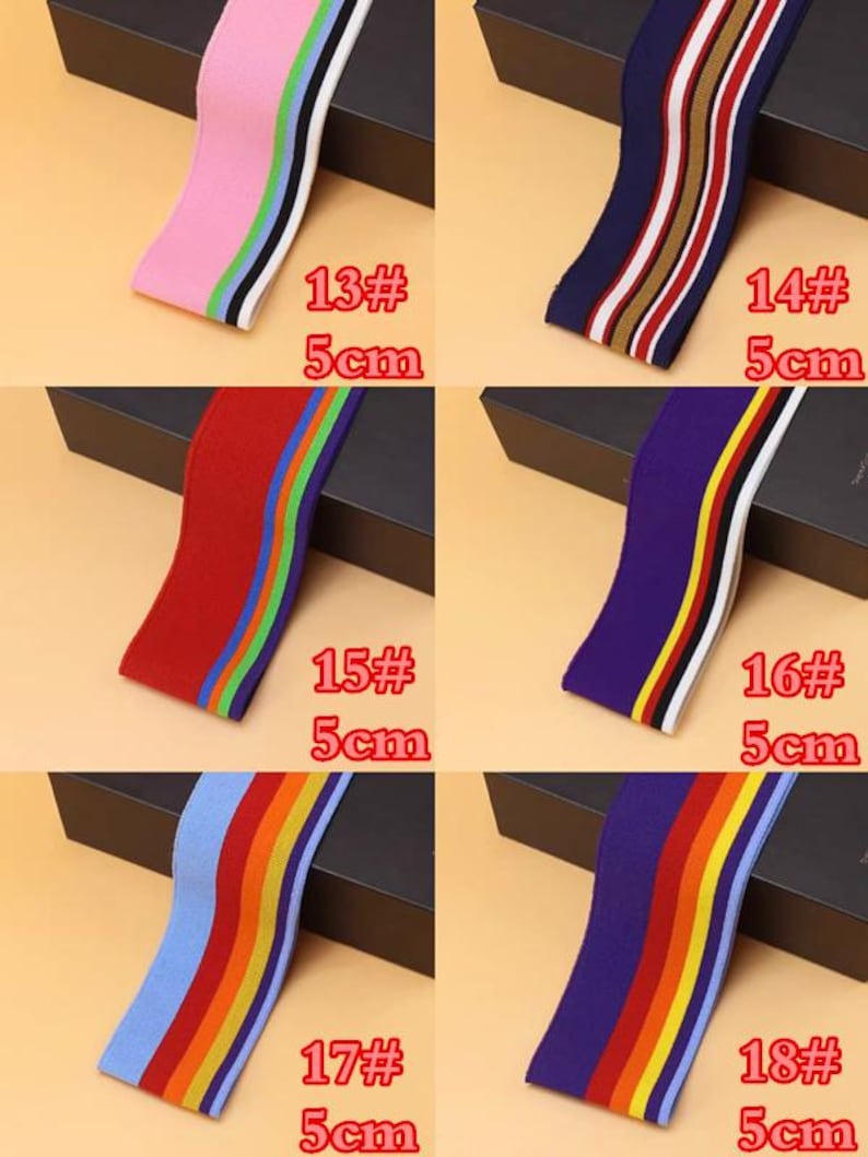 May include: Six different types of elastic trim with colorful stripes. Each trim is 5 cm wide and is labeled with a number and the width. The trims are pink, navy blue, red, purple, light blue, and dark purple.