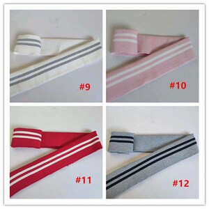 May include: Four samples of knit fabric with contrasting stripes. The fabric is white with gray stripes, pink with white stripes, red with white stripes, and gray with black stripes. The samples are labeled #9, #10, #11, and #12.