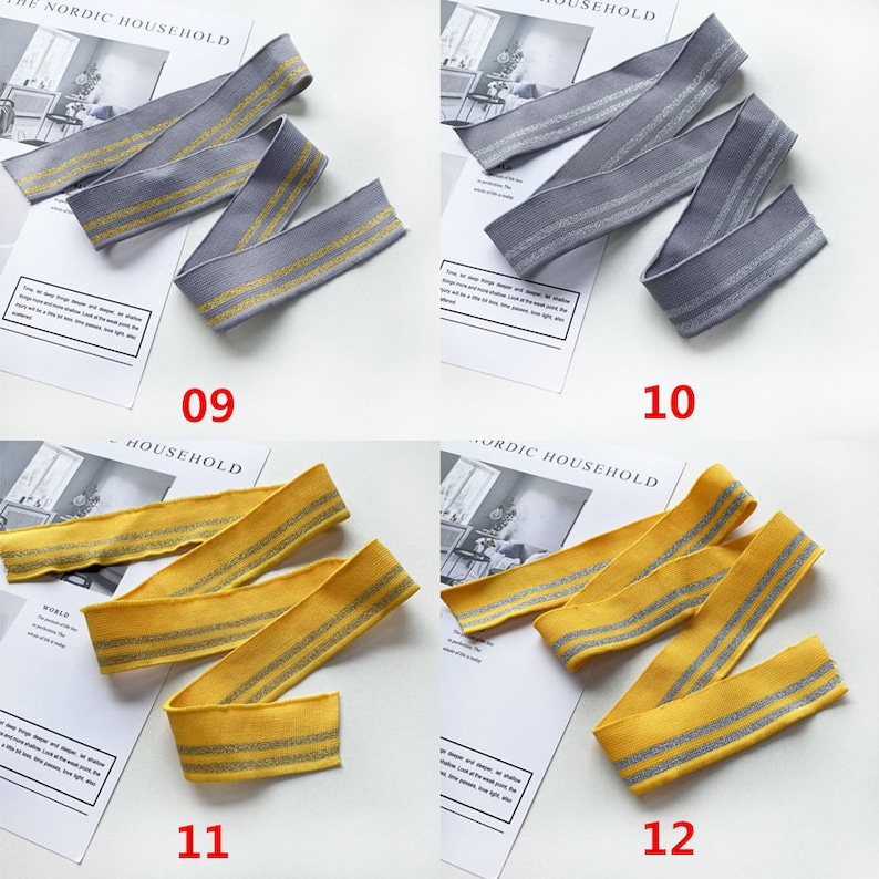 May include: Four samples of elastic trim with silver glitter stripes. The trim is available in gray, yellow, and two shades of yellow. The trim is labeled with numbers 09, 10, 11, and 12.