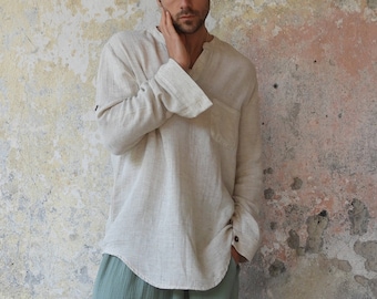 May include: A person wearing a light beige linen shirt with a V-neck and long sleeves, paired with loose-fitting green pants.