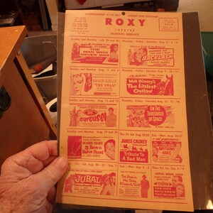 May include: A vintage movie theater schedule for the Roxy Theatre in Randolph, Nebraska, listing films playing from July 29 to September 8, 1955. The schedule includes films such as "The Man Who Never Was", "Backlash", "Grace Kelly in The Swan", "Walt Disney's The Littlest Outlaw", "Carousel", "On the Threshold of Space", "23 Paces to Baker Street", "Tribute to a Bad Man", "Anything Goes", "Jubal", "The Man in the Gray Suit", and "The Man Who Knew Too Much".