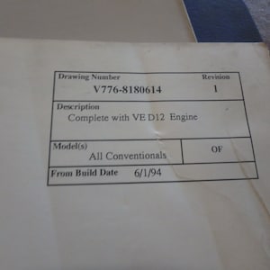 May include: A black and white document with the text "Drawing Number V776-8180614 Revision 1 Description Complete with VE D12 Engine Model(s) All Conventionals OF From Build Date 6/1/94"