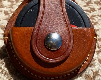 Swedish SNUS or ZYN dip can holder holster with belt clip made of hand-stitched natural full grain leather in traditional or fashion colors.