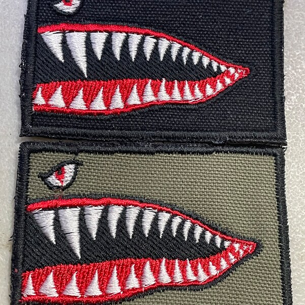 Handmade Flying Tigers shark mouth embroidered 2” x 3” morale patch.  Choice of sew-on or Velcro backing.