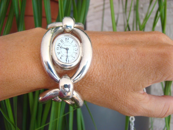 Vintage zeldzame zilveren Zwitserse horloge DULUX. Mechanische Dames Zwitserse zilveren horloges. Zeldzaam Zwitsers horloge in zeer goede staat. Vintage zeldzame zilveren Zwitserse horloge DULUX. Mechanische Dames Zwitserse zilveren horloges. Zeldzaam Zwitsers horloge in zeer goede staat.