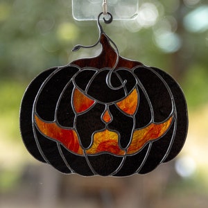 Halloween stained glass horror of black pumpkin