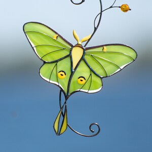 garden decor of luna moth made of modern stained glass