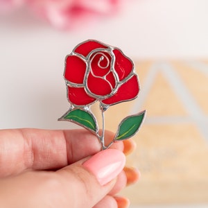 red rose brooch made of modern stained glass