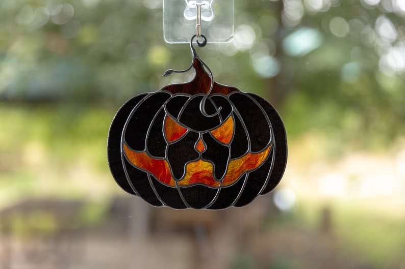 Halloween stained glass horror of black pumpkin