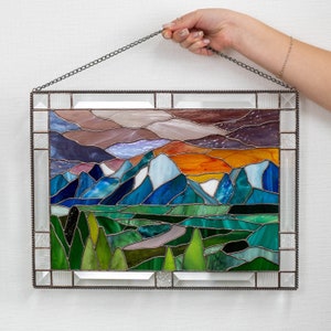 handmade glass panel with blue mountains with purple sky