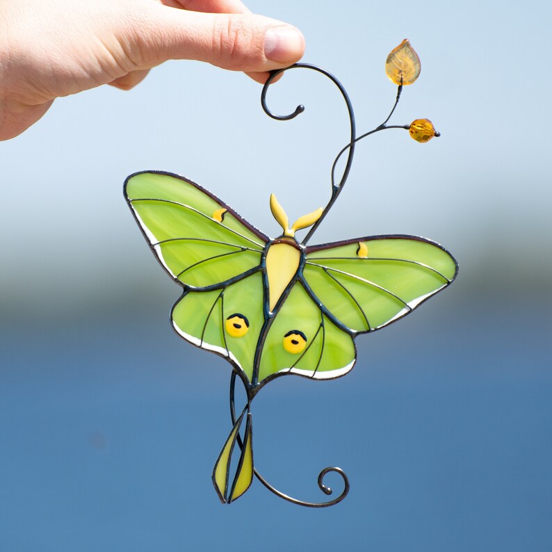 garden decor of luna moth made of modern stained glass