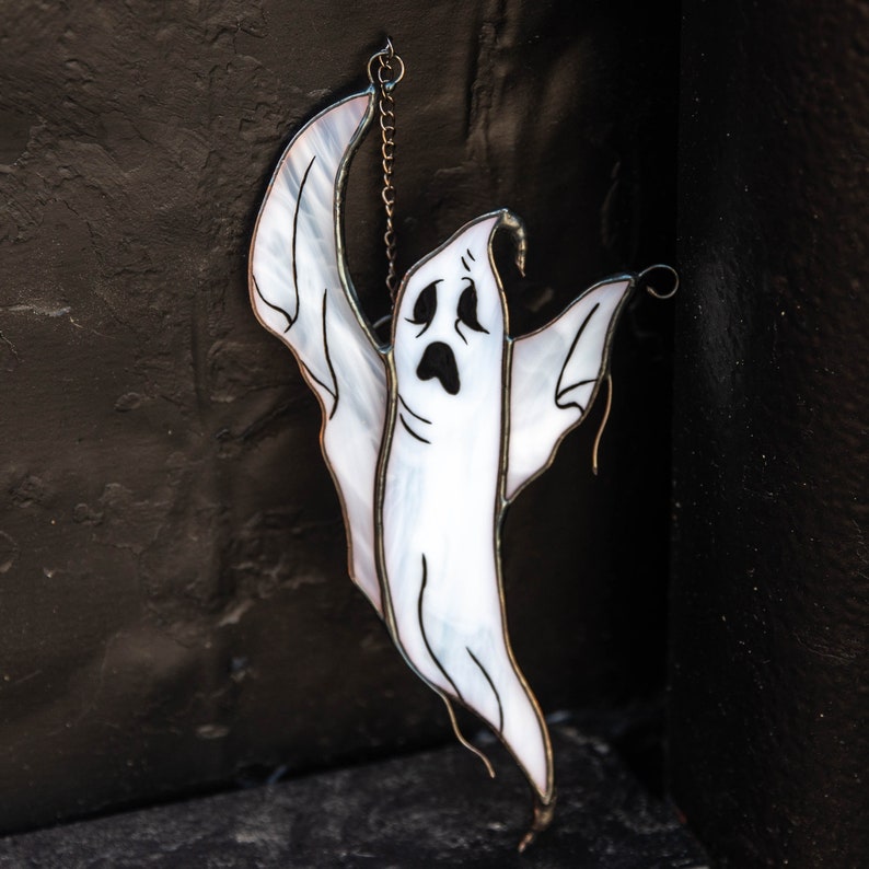 white ghost stained glass window hanging
