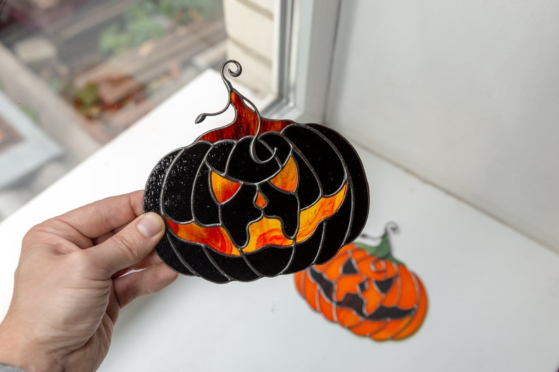 stained glass window hanging of Halloween pumpkin