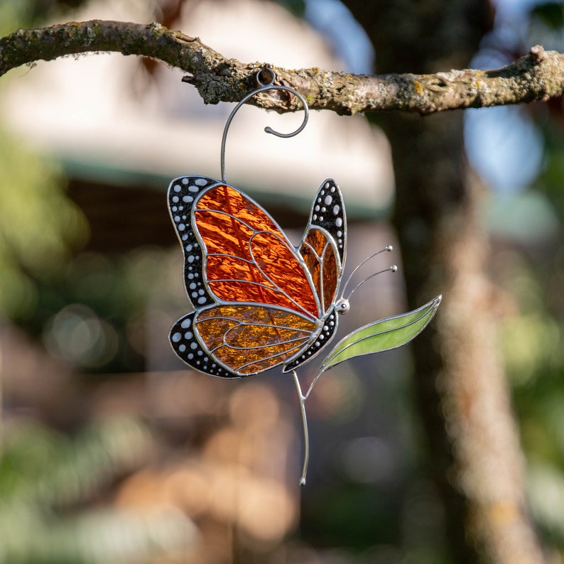 handmade glass butterfly decor hanging on the wire