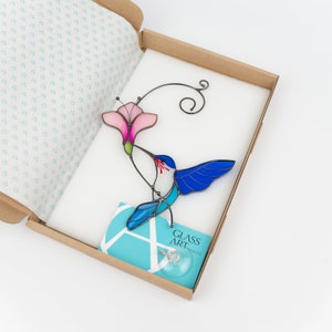 handmade glass hummingbird in the brand box of Glass Art Stories