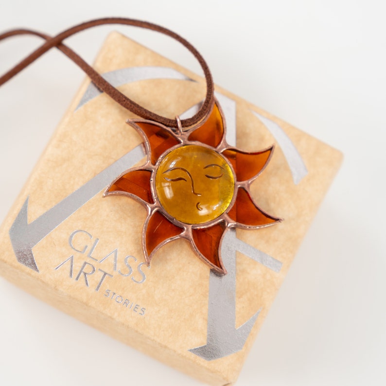 gold sun pendant made of stained glass