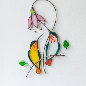 the pair of hummingbirds made of modern stained glass