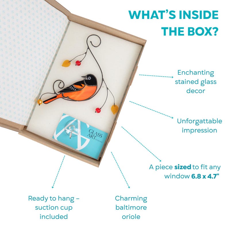 Open gift box showing a stained glass oriole, a suction cup, and branded card, with descriptive arrows pointing to product features.