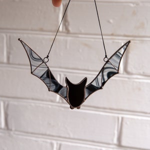 Halloween garden decoration of black bat made of stained glass