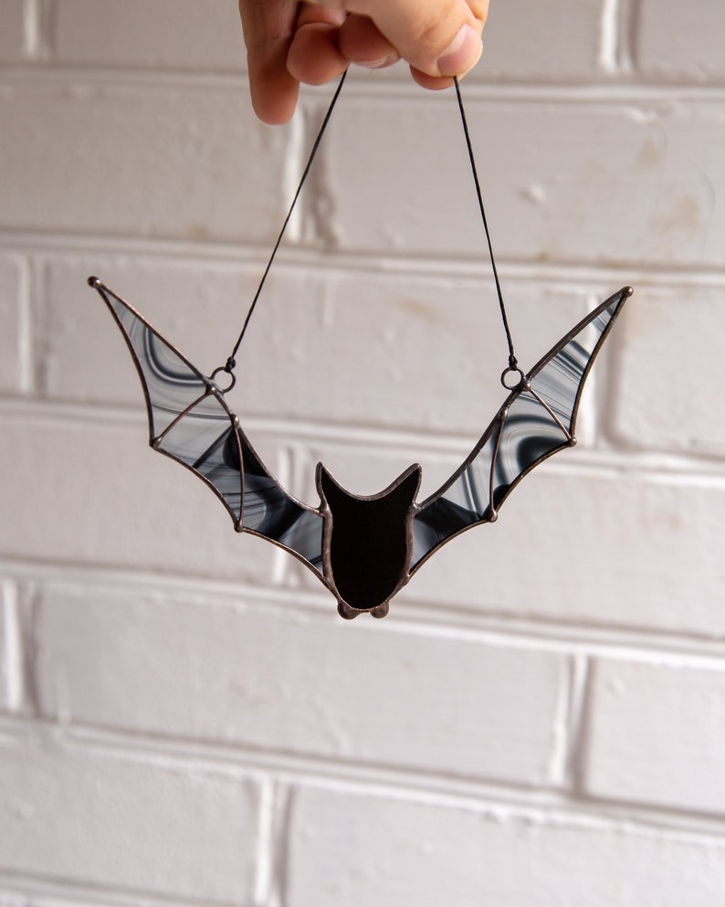 Halloween garden decoration of black bat made of stained glass