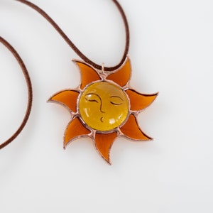 stained glass jewelry of sun